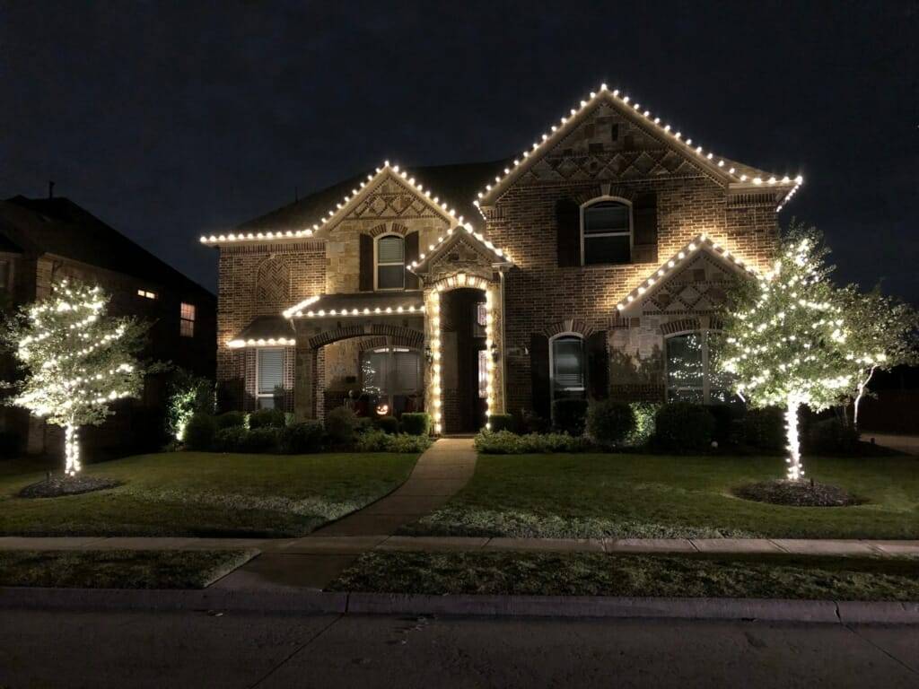 Warm white lights on gables and columns